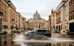 Rome (Italy), 02/01/2021.- A car drives on a flooded street near Via della Conciliazione, close to the Vatican, after a rainfall, in Rome, Italy, 02 January 2021. (Italia, Roma) EFE/EPA/FABIO FRUSTACI
