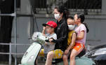 Hanoi (VietNam), 30/04/2021.- A woman and children wearing face masks ride a motorbike in Hanoi, Vietnam, 30 April 2021. Vietnam reported six new local COVID-19 cases for the first time in more than a month, according to the Health Ministry. EFE/EPA/LUONG THAI LINH