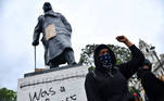 A demonstrator reacts infront of graffiti on a statue of Winston Churchill in Parliament Square during a Black Lives Matter protest in London, following the death of George Floyd who died in police custody in Minneapolis, London, Britain, June 7, 2020. REUTERS/Dylan Martinez TPX IMAGES OF THE DAY