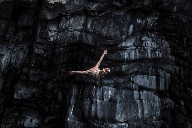 Ponte Brolla (Switzerland), 23/07/2021.- Marwin Weber from Germany jumps into the Maggia river during the qualification of the International Cliff Diving championship in Ponte Brola, Switzerland, 23 July 2021. (Alemania, Suiza) EFE/EPA/Samuel Golay