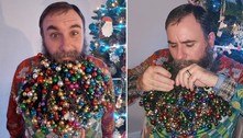 Homem pendura 710 enfeites de Natal na barba e quebra o próprio recorde