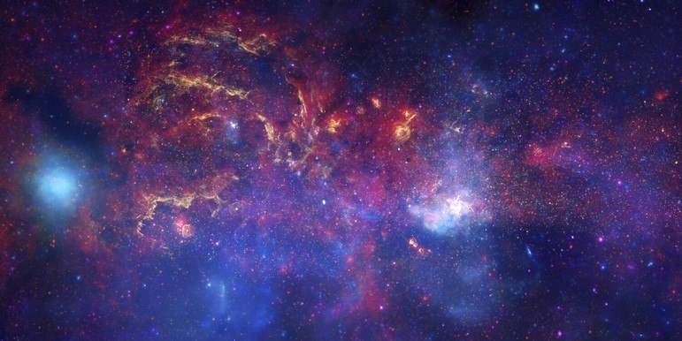Que tal ter uma visão única da região central da Via Láctea?! É o que fez a Nasa ao relembrar a imagem acima, feita para comemorar o Dia Internacional da Astronomia, em 2009. A foto foi capturada pelo Hubble, e reúne diversos comprimentos de onda de luz, com cores diferentes