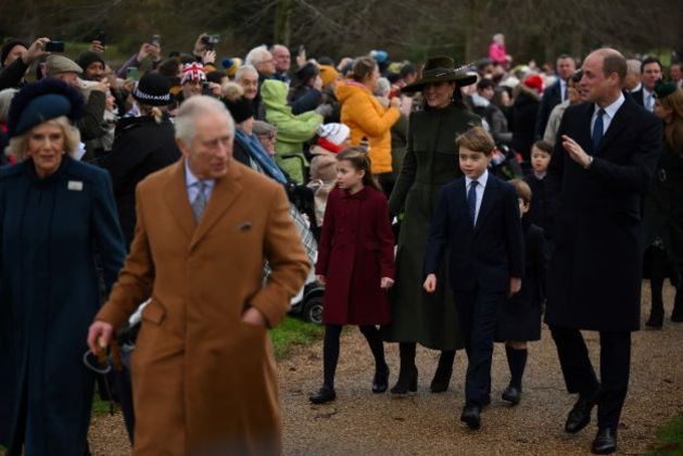 BRITAIN-ROYALS-CHRISTMAS
(Second row from L) Britain's Princess Charlotte of Wales, Britain's Catherine, Princess of Wales, Britain's Prince George of Wales, Britain's Prince Louis of Wales and Britain's Prince William, Prince of Wales walk behind Britain's Camilla, Queen Consort (first row L) and Britain's King Charles III (first row R) as they arrive for the Royal Family's traditional Christmas Day service at St Mary Magdalene Church in Sandringham, Norfolk, eastern England, on December 25, 2022.

