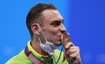 Gold medallist Britain's Tom Dean (C), silver medallist Britain's Duncan Scott (L) and bronze medallist Brazil's Fernando Scheffer (R) pose with their medals on the podium of the final of the men's 200m freestyle swimming event during the Tokyo 2020 Olympic Games at the Tokyo Aquatics Centre in Tokyo on July 27, 2021.
Attila KISBENEDEK / AFP