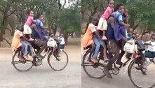 Homem é flagrado enquanto transporta nove crianças sobre bicicleta