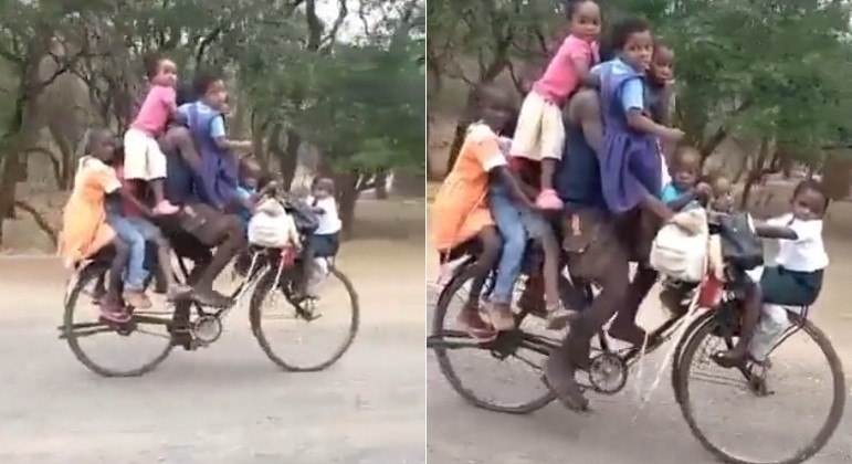 Homem foi flagrado enquanto transporta nove crianças em uma bicicleta