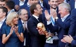 French President Emmanuel Macron and his wife Brigitte Macron pose with France soccer team captain Hugo Lloris holding the trophy, coach Didier Deschamps and players before a reception to honour the France soccer team at the Elysee Palace in Paris
French President Emmanuel Macron and his wife Brigitte Macron pose with France soccer team captain Hugo Lloris holding the trophy, coach Didier Deschamps and players before a reception to honour the France soccer team after their victory in the 2018 Russia Soccer World Cup, at the Elysee Palace in Paris, France, July 16, 2018. REUTERS/Philippe Wojazer