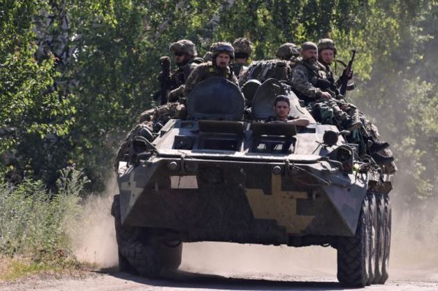 Ukrainian soldiers on top of an Ukrainian armoured fighting vehicle are pictured on a road in the countryside of Siversk, in Donetsk Oblast, eastern Ukraine, on July 8, 2022, amid the Russian invasion of Ukraine.
MIGUEL MEDINA / AFP