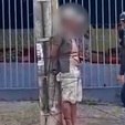 Homem é amarrado em poste após suspeita de estuprar mulher em calçada (Reprodução / Record TV)