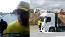 Vídeo: manifestante viraliza ao se pendurar em caminhão para impedir passagem 