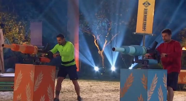 Os aliados Caique Aguiar e Raphael Sander vão se enfrentar em um Desafio de Sobrevivência com pontaria, raciocínio e equilíbrio