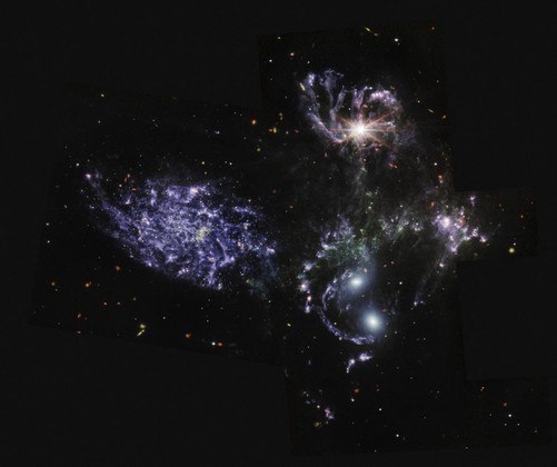 Mid-Infrared Instrument (MIRI) on the James Webb Space Telescope (JWST) shows never-before-seen details of Stephan’s Quintet, a visual grouping of five galaxies. MIRI pierced through dust-enshrouded regions to reveal huge shock waves and tidal tails, gas and stars stripped from the outer regions of the galaxies by interactions. It also unveiled hidden areas of star formation. The new information from MIRI provides invaluable insights into how galactic interactions may have driven galaxy evolution in the early universe. The JWST is the most powerful telescope launched into space and it reached its final orbit around the sun, approximately 930,000 miles from Earths orbit, in January, 2022. The technological improvements of the JWST and distance from the sun will allow scientists to see much deeper into our universe with greater detail