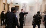 Supporters of President Donald Trump set off a fire extinguisher after breaching security defenses, as police move in on the demonstrate on the second floor of the U.S. Capitol near the entrance to the Senate, in Washington, U.S., January 6, 2021. REUTERS/Mike Theiler
