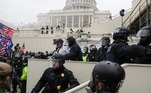 Police officers stand guard as supporters of U.S. President Donald Trump gather in front of the U.S. Capitol Building in Washington, U.S., January 6, 2021. REUTERS/Leah Millis