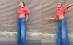 Isis Valverde preferiu um lookinho básico, com uma camisa rosa e laranja e óculos de sol. Além disso, ela usou uma calça larguinha jeans de cintura baixa