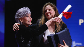 Jane Fonda receives an award on the back of the Palme d’Or-winning director at the Cannes Film Festival