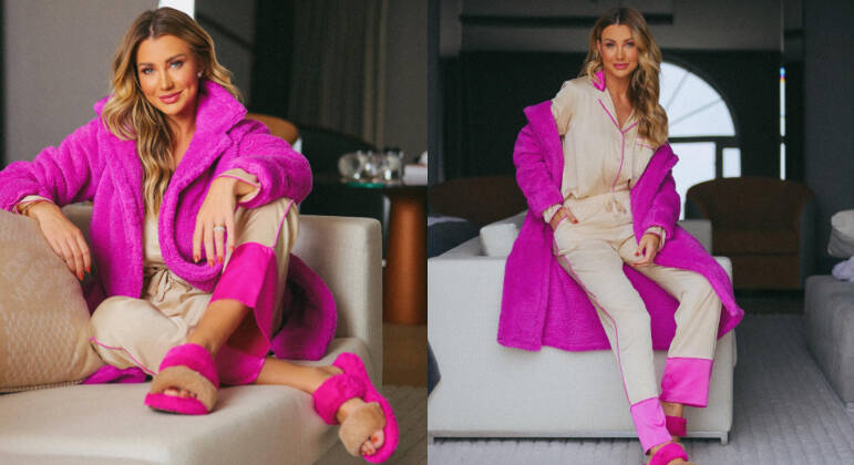 Mesmo de pijama, Ana Paula não abre mão de looks modernos e estilosos. Em um clique postado, a influenciadora aparece usando um roupão rosa pink + um conjuntinho creme com detalhes no mesmo tom de rosa. 