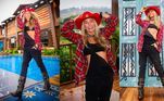 Na coletiva de imprensa do reality, Galisteu entrou na onda do diretor Rodrigo Carelli, e apostou em um figurino clássico de A Fazenda. A loira usou macacão e top preto, botas de couro, camisa quadriculada vermelha e chapéu no mesmo tom. Perceba que o acessório homenageia os 70 anos da Record TV! Vale observar também o detalhe do lencinho amarrado no pescoço, combinando com o conjunto de jóias em couro e pedras escuras