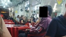 Homem usa faixa com símbolo do nazismo em bar de Unaí, em MG
