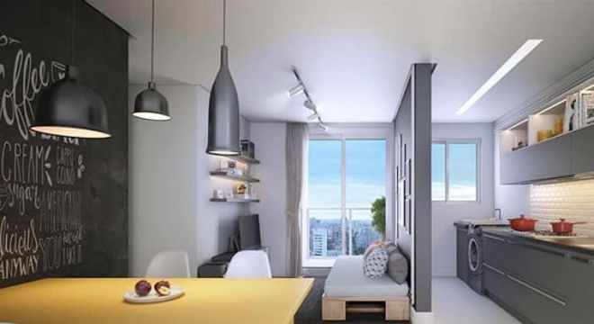 O piso laminado utilizado delimita a área da sala de estar e sala de jantar