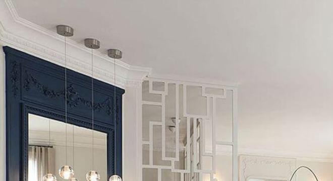 Parede azul e branco com sofá verde