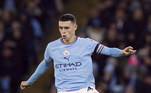 5º) Phil FodenO inglês de 22 anos é fundamental no Manchester City, clube onde joga desde as categorias de base. Aos 22 anos, o meio-campista vale 139 milhões de euros para o clube da Inglaterra. O valor equivale a R$ 778 milhões