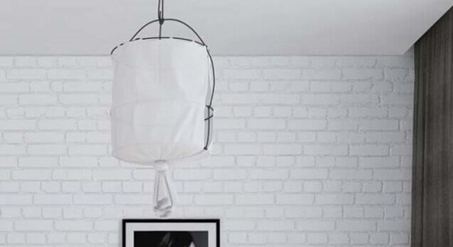 quadro preto e branco para quarto de casal com parede de tijolinho