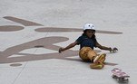 Brazil's Rayssa Leal falls down during the women's street preliminary round during the Tokyo 2020 Olympic Games at Ariake Sports Park Skateboarding in Tokyo on July 26, 2021.
