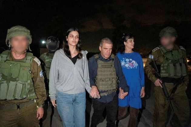Judith Tai Raanan and her daughter Natalie Shoshana Raanan, U.S. citizens who were taken as hostages by Palestinian Hamas militants, walk while holding hands with Brig.-Gen. (Ret.) Gal Hirsch, Israel's Coordinator for the Captives and Missing, after they were released by the militants, in response to Qatari mediation efforts, in this handout picture obtained by Reuters on October 20, 2023. Government of Israel/Handout via REUTERS THIS IMAGE HAS BEEN SUPPLIED BY A THIRD PARTY. FACES BLURRED AT SOURCE