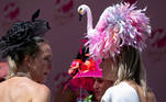 Spectators drink Mint Julep as they wait to have their photo taken on the day of the 147th Oaks, the day before Kentucky Derby at Churchill Downs in Louisville, Kentucky, U.S. April 30, 2021. REUTERS/Amira Karaoud TPX IMAGES OF THE DAY

