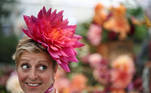 A person wearing a floral headpiece poses while attending the final day of the Chelsea Flower Show, delayed from its usual spring dates because of the lockdown restrictions amid the spread of the coronavirus disease (COVID-19) pandemic in London, Britain, September 26, 2021. REUTERS/Henry Nicholls