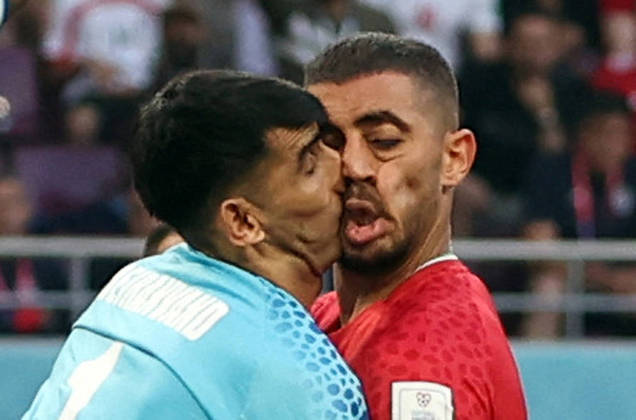 Soccer Football - FIFA World Cup Qatar 2022 - Group B - England v Iran - Khalifa International Stadium, Doha, Qatar - November 21, 2022 Iran's Alireza Beiranvand clashes into Majid Hosseini REUTERS/Paul Childs