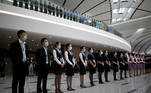 Staff members wearing face masks following the coronavirus disease (COVID-19) outbreak take part in an event marking airport's first launching anniversary at the Beijing Daxing International Airport, ahead of Chinese National Day holiday, in Beijing, China September 25, 2020. REUTERS/Carlos Garcia Rawlins