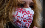 A woman wearing a protective mask with the message "Public healthcare for all" attends a protest calling for the protection of public healthcare and primary healthcare centres amid the coronavirus disease (COVID-19) outbreak, in Madrid, Spain, November 15, 2020. REUTERS/Juan Medina