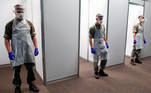 Soldiers wearing protective equipment get prepared to collect swap samples at a coronavirus disease (COVID-19) testing centre in Liverpool, Britain, November 6, 2020. REUTERS/Phil Noble