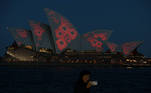 Poppies are seen projected onto the Sydney Opera House in observance of Remembrance Day, commemorating the signing of the peace agreement that ended the first World War and honouring those who served, in Sydney, Australia, November 11, 2020. REUTERS/Loren Elliott