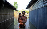 A flood-affected man stands in the water after his house got flooded in Bogura, Bangladesh July 17, 2020. REUTERS/Mohammad Ponir Hossain TPX IMAGES OF THE DAY