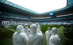 Soccer Football - Brasileiro Championship - Gremio v Fortaleza - Arena do Gremio, Porto Alegre, Brazil - September 13, 2020 General view of staff wearing personal protective equipment (PPE) inside the stadium before the match following the outbreak of the coronavirus disease (COVID-19) REUTERS/Diego Vara/File Photo TPX IMAGES OF THE DAY SEARCH 'POY SPORTS' FOR THIS STORY. SEARCH 'REUTERS POY' FOR ALL BEST OF 2020 PACKAGES