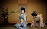 Ikuko, the "big sister" of Tokyo's Akasaka geisha district, came to the capital to seek her fortune in 1964, the year Tokyo first hosted the Olympics. But the novel coronavirus pandemic has made her fear for her centuries-old profession as never before. Though the number of geisha - famed for their witty conversation, beauty and skill at traditional arts - has been falling for years, Ikuko and her colleagues were without work for months due to Japan's state of emergency and now operate under awkward social distancing rules. "There were more than 400 geisha in Akasaka when I came, so many I couldn't remember their names. But times changed," Ikuko, now 80, said. Only 20 remain, and there aren't enough engagements to take on new apprentices - especially now. Coronavirus-induced austerity has slashed expense accounts, and many people remain wary of spending hours in the elegant but closed traditional rooms where geisha entertain. Engagements are down 95 percent, and come with new rules: no pouring drinks for customers or touching them even to shake hands, and sitting 2 metres apart. Masks are hard to wear with their elaborate wigs, so they mostly don't. REUTERS/Kim Kyung-Hoon SEARCH "GEISHA COVID-19" FOR THIS STORY. SEARCH "WIDER IMAGE" FOR ALL STORIES. TPX IMAGES OF THE DAY