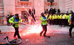 A firework explodes as police officers clash with demonstrators in Whitehall during a Black Lives Matter protest in London, following the death of George Floyd who died in police custody in Minneapolis, London, Britain, June 7, 2020. REUTERS/Dylan Martinez TPX IMAGES OF THE DAY