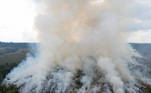 Smoke from burning vegetation rises in Brazilian Amazon rainforest, in Apui, Amazonas state, Brazil, September 4, 2021. Picture taken with a drone September 4, 2021. REUTERS/Bruno Kelly