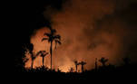 Smoke from a fire rises into the air as trees burn amongst vegetation in Brazil's Amazon rainforest next to the Transamazonica national highway, in Canutama, Amazonas state, Brazil, September 2, 2021. Picture taken September 2, 2021. REUTERS/Bruno Kelly