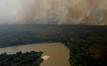An aerial view shows smoke from a fire rising above vegetation around the Cuiaba river in the Pantanal, the world's largest wetland, in Pocone, Mato Grosso state, Brazil, August 28, 2020. REUTERS/Amanda Perobelli SEARCH 'PANTANAL PEROBELLI' FOR THIS STORY. SEARCH 'WIDER IMAGE' FOR ALL STORIES