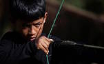 A boy shoots a bow and arrow during the Indigenous Games in Peruibe, Brazil April 23, 2023. REUTERS/Carla Carniel TPX IMAGES OF THE DAY