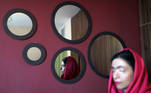 Iranian woman Masoumeh, who alleges she is a victim of acid attack by her father-in-law, is reflected in a mirror at her home in Parand, suburb of Tehran, Iran November 5, 2020. Picture taken November 5, 2020. Majid Asgaripour/WANA (West Asia News Agency) via REUTERS ATTENTION EDITORS - THIS IMAGE HAS BEEN SUPPLIED BY A THIRD PARTY
