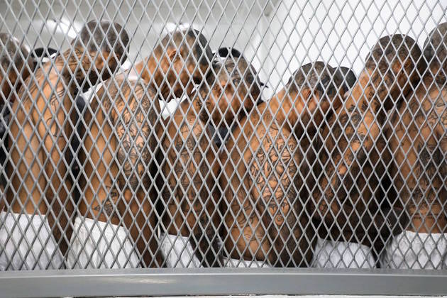 1 - Gang members wait to be taken to their cells after 2000 gang members were transferred to the Terrorism Confinement Center, according to El Salvador's President Nayib Bukele, in Tecoluca, El Salvador, in this handout distributed to Reuters on February 24, 2023. 