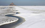 A view shows the snow-covered Bay of Mont Saint-Michel in the French western region of Normandy, as winter weather with snow and cold temperatures hits a large northern part of the country, France, February 10, 2021. REUTERS/Stephane Mahe TPX IMAGES OF THE DAY