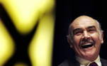 FILE PHOTO: Actor Sean Connery laughs as he listens to a speech by Alex Salmond at a Scottish National Party rally at the Edinburgh International conference centre April 26. REUTERS/Jeff J Mitchell/File Photo