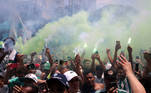 Soccer Football - Copa Libertadores - Palmeiras depart for Uruguay ahead of the Copa Libertadores final - Academia de Futebol Palmeiras Training Centre, Sao Paulo, Brazil - November 24, 2021 Fans with flares as Palmeiras depart ahead of the final REUTERS/Amanda Perobelli