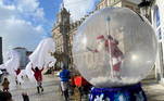 2 - A man dressed up as Santa Claus waves to children from inside a plastic ball as a protective measure against the coronavirus disease (COVID-19), in Ferrol, in the northwestern Spanish region of Galicia, Spain December 24, 2020. REUTERS/Nacho Doce TPX IMAGES OF THE DAY